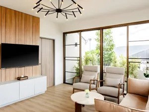 Phòng khách với bàn ghế sofa và cửa trượt kính ban công